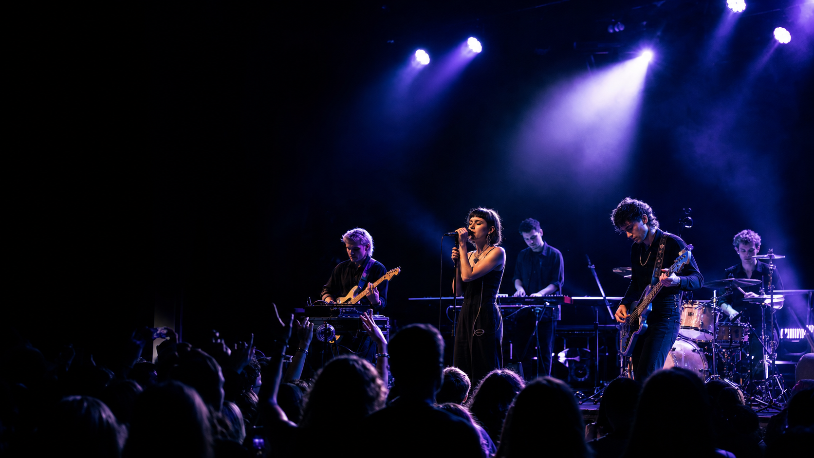 Alternative electronic band performing under violet lights